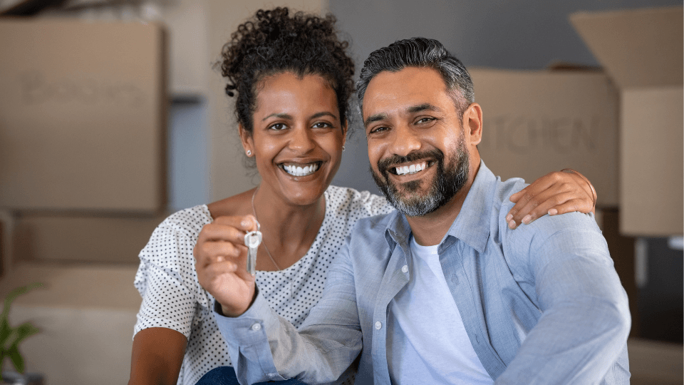 Couple with new home keys